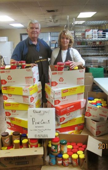 Soup kitchen volunteers thanking "Pine Crest" for the donation of goods.