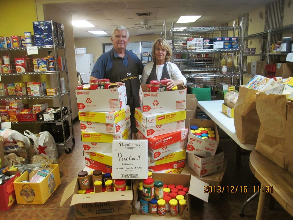 Soup kitchen volunteers thanking "Pine Crest" for the donation of goods.