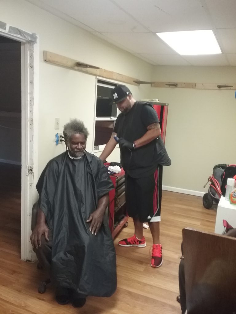 A man gives out haircuts to help the poor.