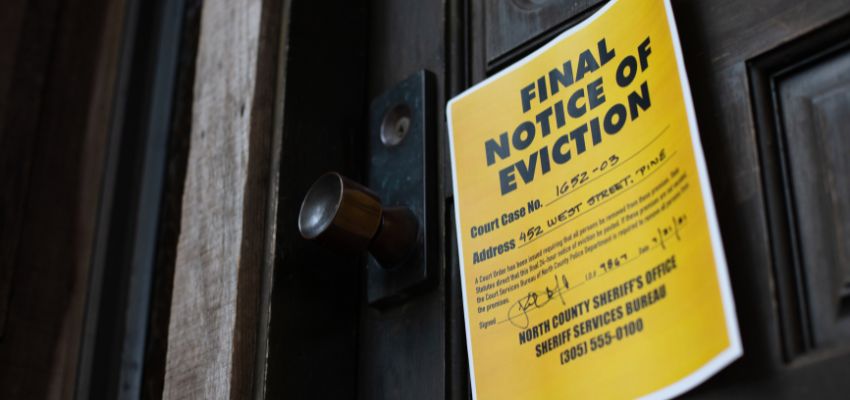 A house with a notice of eviction.