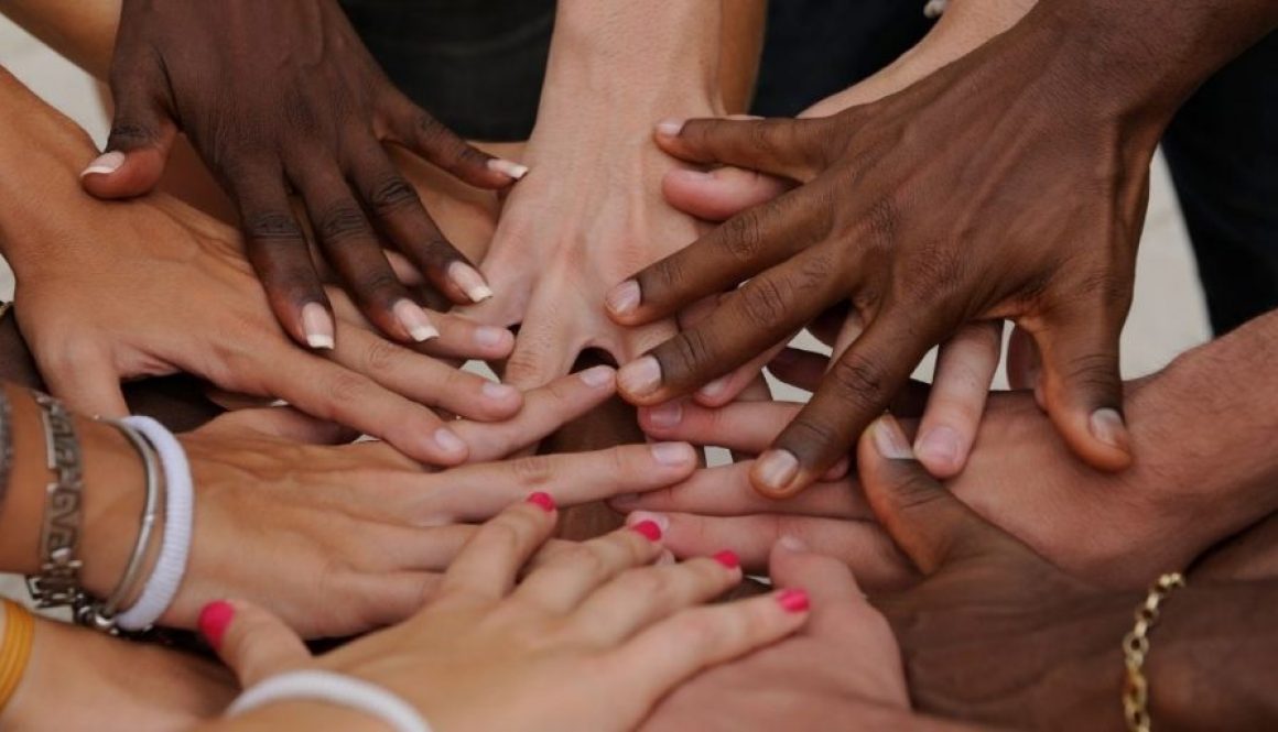 Diverse human hands showing unity and humanity for love