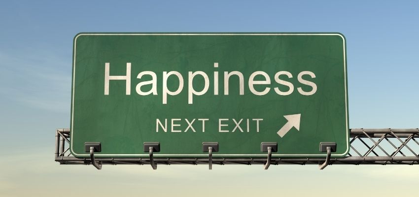 A road sign pointing to happiness.
