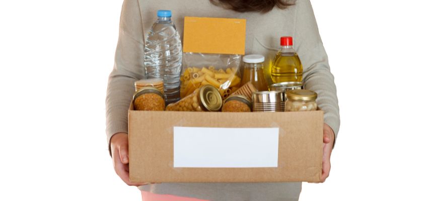 A box of expired food donations will be put into the trash because eating expired foods is unsafe.