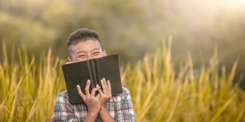 A kid feels great while reading life-changing bible verses.