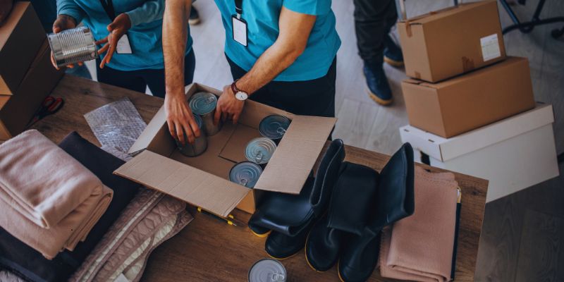 Volunteers prepared boxes of essential items needed by homeless people.